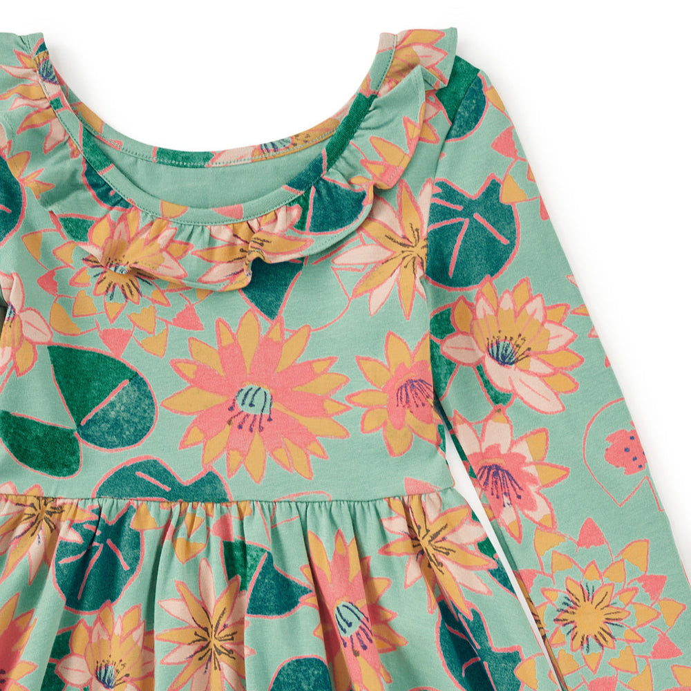 Floral patterned dress with long sleeves on a white background