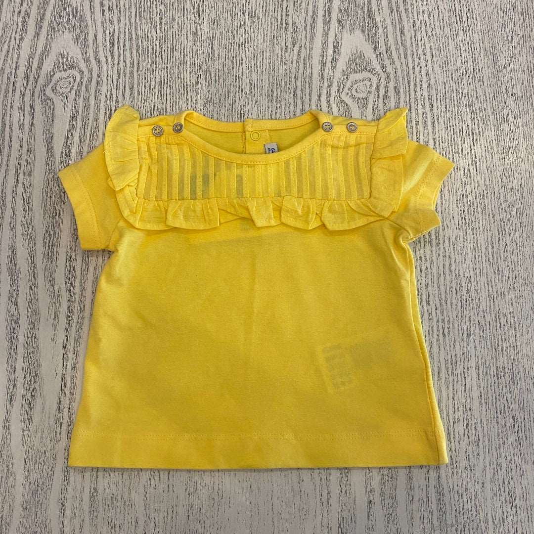 a yellow t shirt with ruffles