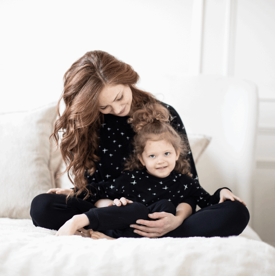 mom holding toddler in peregrine black bamboo sweatshirt and sweatpants