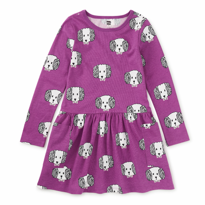 Purple dress with dog pattern on a white background