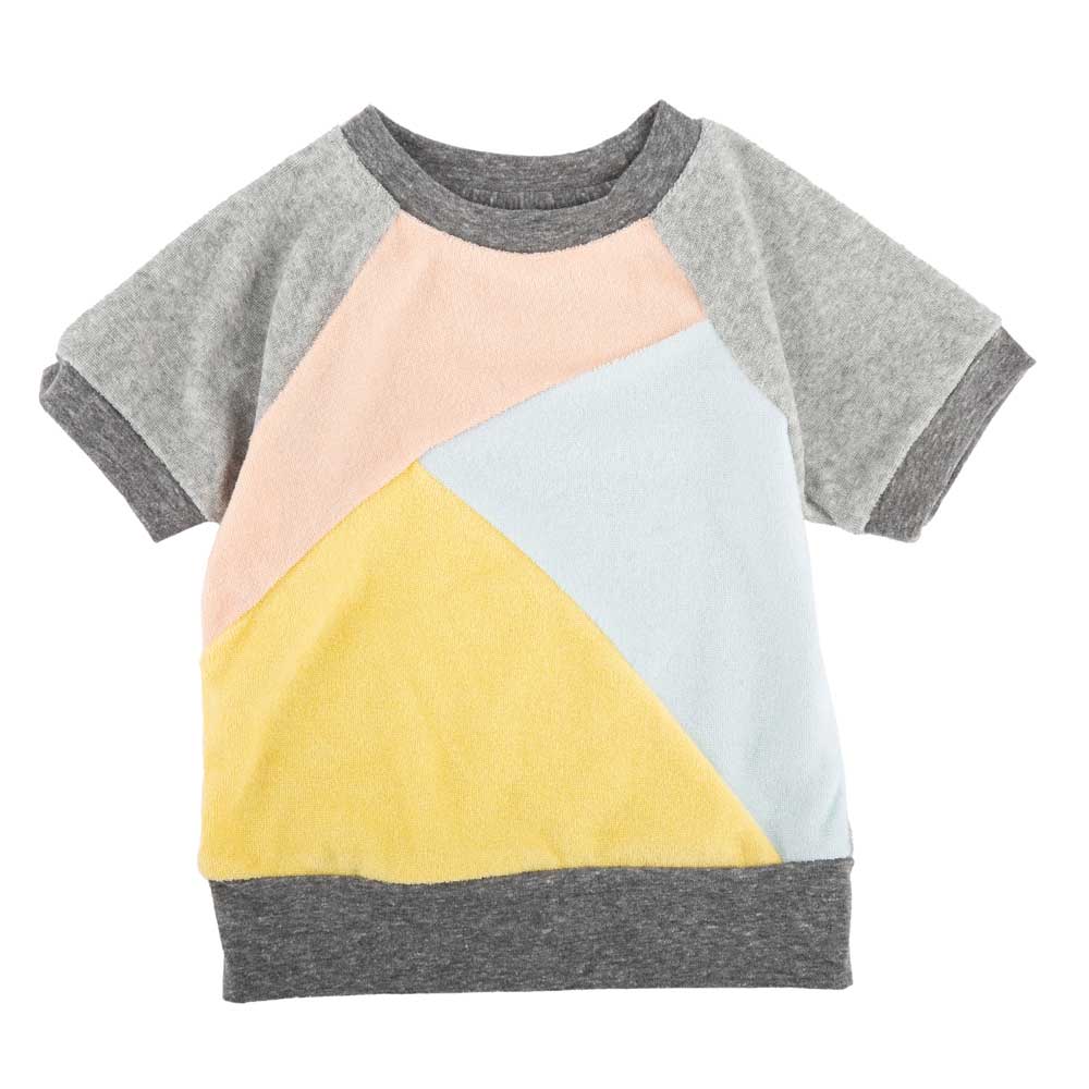 the front of the shirt with pink, blue and yellow color blocks
